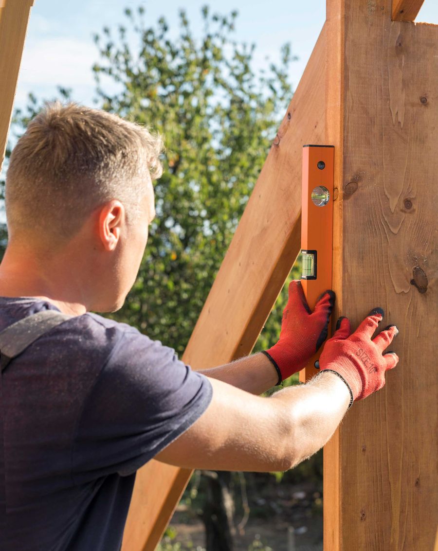 Carpenter taking measurements