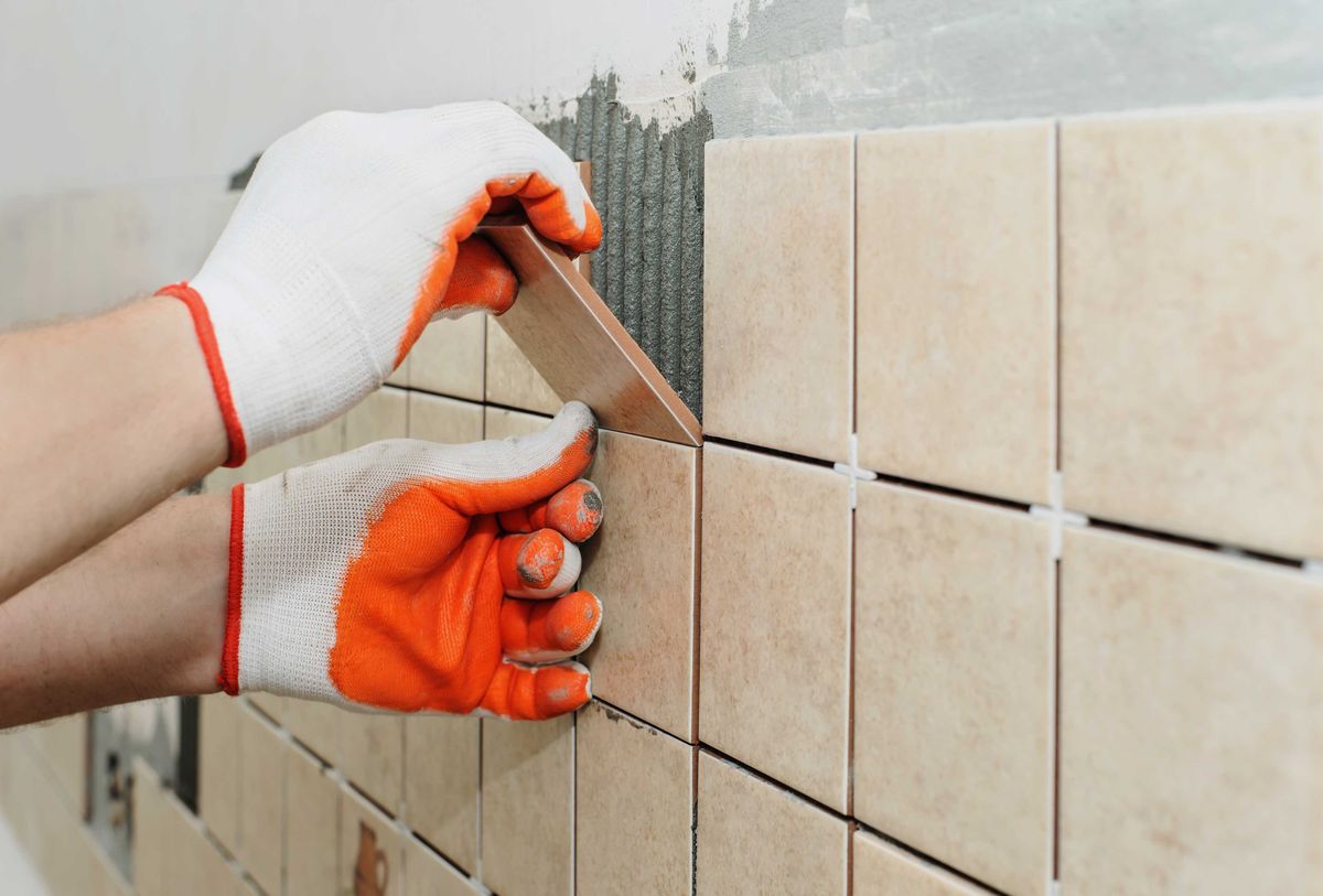 Tiler laying tiles